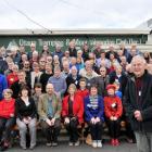 Bob Stables (front, at right) and Otago Tramping and Mountaineering Club members celebrate the...