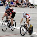 Bob Thwaites, of Invercargill, crosses the finish line ahead of Cathy Jordan, also of...