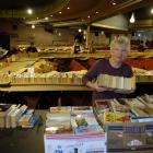 Book sorter Prue Turnbull packs up leftover books. Photo by Jane Dawber
