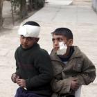 Boys wounded in a car bomb attack are seen after treatment at a primary school in Mussayab, about...