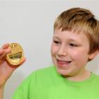 Bradford School pupil Aaron Rumpler with his medal for gaining top marks in the International...