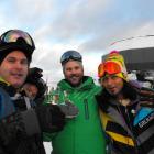 Brendon Cameron, Karl Hunt and Eddy Lecotey, all of Queenstown, make the most of the free bubbly...