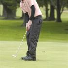 Brent McEwan, of the St Clair club, sinks a putt on his way to winning the Otago strokeplay...
