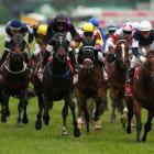 Brett Prebble riding Green Moon (R) crosses the finish line to win the Emirates Melbourne Cup...