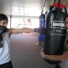 Brett Toia (19) gets a boxing lesson from  Dunedin Training Centre fitness programme co-ordinator...