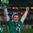 Brian O'Driscoll celebrate with the trophy after Ireland won the Six Nations championship with a...
