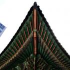 Brightly coloured, intricately patterned eaves of Deokhongjeon, the building used by Emperor...