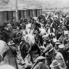 Bringing up the last of the horses to the troopships at Port Chalmers wharf. - Otago Witness, 30...