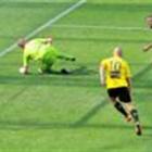 Brockie shoots past Heart goalkeeper Andrew Redmayne, as the Heart's Patrick Gerhardt and the...