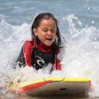 Bronson Monga (4), of Dunedin, rides his bodyboard on a sunny day at St Clair beach yesterday....