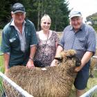 Bruce (left) and Kate McLachlan, from Clarendon, with the ram they paid $1050 for, and vendor...