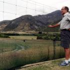 Bruce Patton looks out from his property on Lakes Hayes Estate. Photo by David Williams.