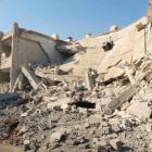 Buildings in Daria near Damascus show damage caused by missiles fired by a Syrian Air Force...