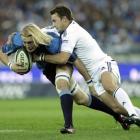 Bulls player Dewald Potgieter, left, defends against Stormers' Andries Bekker, right, during the...