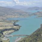 The Waitaki dam, with Lake Waitaki stretching out behind it. The power station started producing...