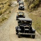 Crossing Danseys Pass yesterday are (front to rear): a 1930 Ford Model A delivery van, a 1927...