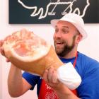 Cain Lindegreen holds a ham in the Havoc Farm Pork store in Dunedin. Photo by Stephen Jaquiery.