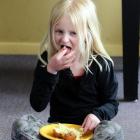 Calton Hill Primary School pupil Reyana Wilson (8) tucks into a baked potato at school. Photo by...