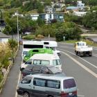 Campervans and vehicles in which people are sleeping line up at Macandrew Bay early yesterday in...