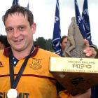 Captain Barry Fox holds the NPC third division trophy after North Otago's 43-19 win over...