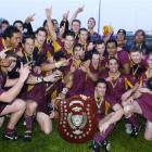 Captain Matt Clutterbuck holds the Speight's championship shield as the Alhambra-Union squad...