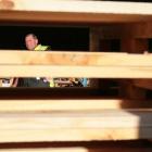 Cargill Enterprises worker Richard Gutsell walks behind some of his completed pallets. Photo by...