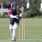 Carisbrook-Dunedin skipper Sean Eathorne is bowled by Kaikorai bowler Craig Sneddon in the...