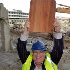 Carisbrook Rotary Project committee member Lindsay Thorburn holds a rimu chopping board at...