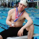 Carlos Biggemann (19) shows off the three medals he won at the Down Syndrome International...