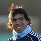 Carlos Tevez smiles as he leaves an Argentina training session in Buenos Aires. Argentina is...