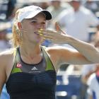 Caroline Wozniacki of Denmark blows kisses to the crowd after she defeated Chang Kai-chen of...