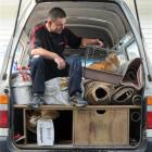 Carpet Court contractor Kerry Bell checks up on his uninvited hitchhiker at the Otago SPCA...