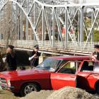 Cars loaded with with youths were pulled over at police checkpoints at the entrances to Alexandra...