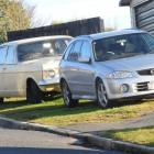 Cars parked on a grass verge in Dunedin yesterday.