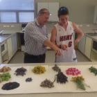 Catlins Area School hospitality teacher Sabin Perkins  shows head boy Tyler Ford (17) wild herbs...