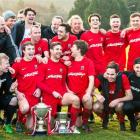 Caversham players celebrate another Football South Premier League title at Sunnyvale on Saturday....