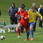 Caversham's Seamus Ryder (left) and Cashmere Technical's Jeremy Wild chase the ball during the...