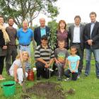 Celebrating the planting of the first tree - a heritage apple - at the new South Dunedin...