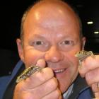 Central Otago Ecological Trust chairman Grant Norbury is pictured with two Otago skinks. Supplied...