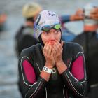 Carrie Lester, from Australia, warms her hands before the start at Challenge Wanaka on Saturday.