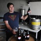 Champion home-brewer Brendan Bransgrove checks the quality of his award-winning Little Jimi...