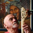 With his grandmother Huhana looking over his shoulder, Lou Armstrong studies a traditional Maori...