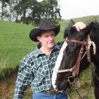 Charity horse trek organiser Johnny Perkins with Emily at his Tuturau farm. Photo by Allison Rudd.