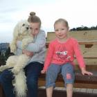 Charli (8, left) and sister Meg (4), with Daisy at home in Kaitangata this week. Photo by Helena...