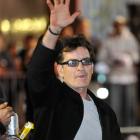 Charlie Sheen waves to fans as he leaves the Chicago Theatre earlier this month. (AP Photo/Brian...
