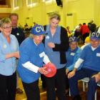 Chateau Village carers Judy Gold (left) and Stacey Wilson (right) help Rose Bradshaw in the floor...