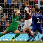 Chelsea's Branisiav Ivanovic (R) scores past Burnley goalkeeper Tom Heaton. REUTERS/Andrew Yates