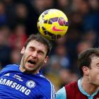 Chelsea's Branislav Ivanovic (L) vies for the ball with Burnley's Ashley Barnes Reuters / Eddie...