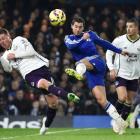 Chelsea's Eden Hazard (C) shoots past Everton's James MacCarthy. REUTERS/Toby Melville