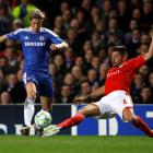 Chelsea's Fernando Torres (L) is challenged by Benfica's Javi Garcia during their Champions...